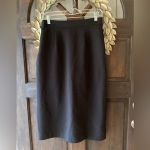Black pencil skirt, classic. Size XL- runs small. Side zipper with slit in back